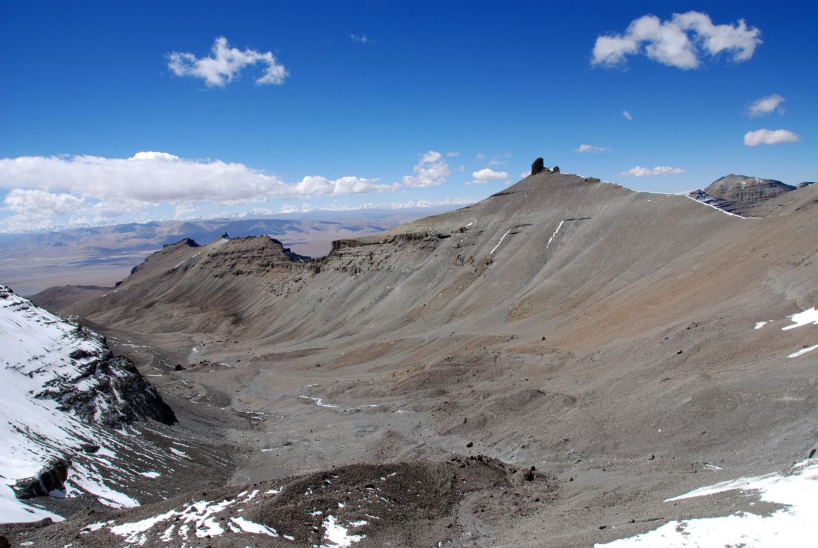 27 Looking Down The Valley To The West Of Nandi From The 13 Golden Chortens On Mount Kailash South Face In Saptarishi Cave On Mount Kailash Inner Kora Nandi Parikrama The panorama view now looks back down the valley that I earlier trekked to the west of Nandi from The 13 Golden Chortens on Mount Kailash South Face in Saptarishi Cave. The lingam-shaped rock is on the west wall of the valley.